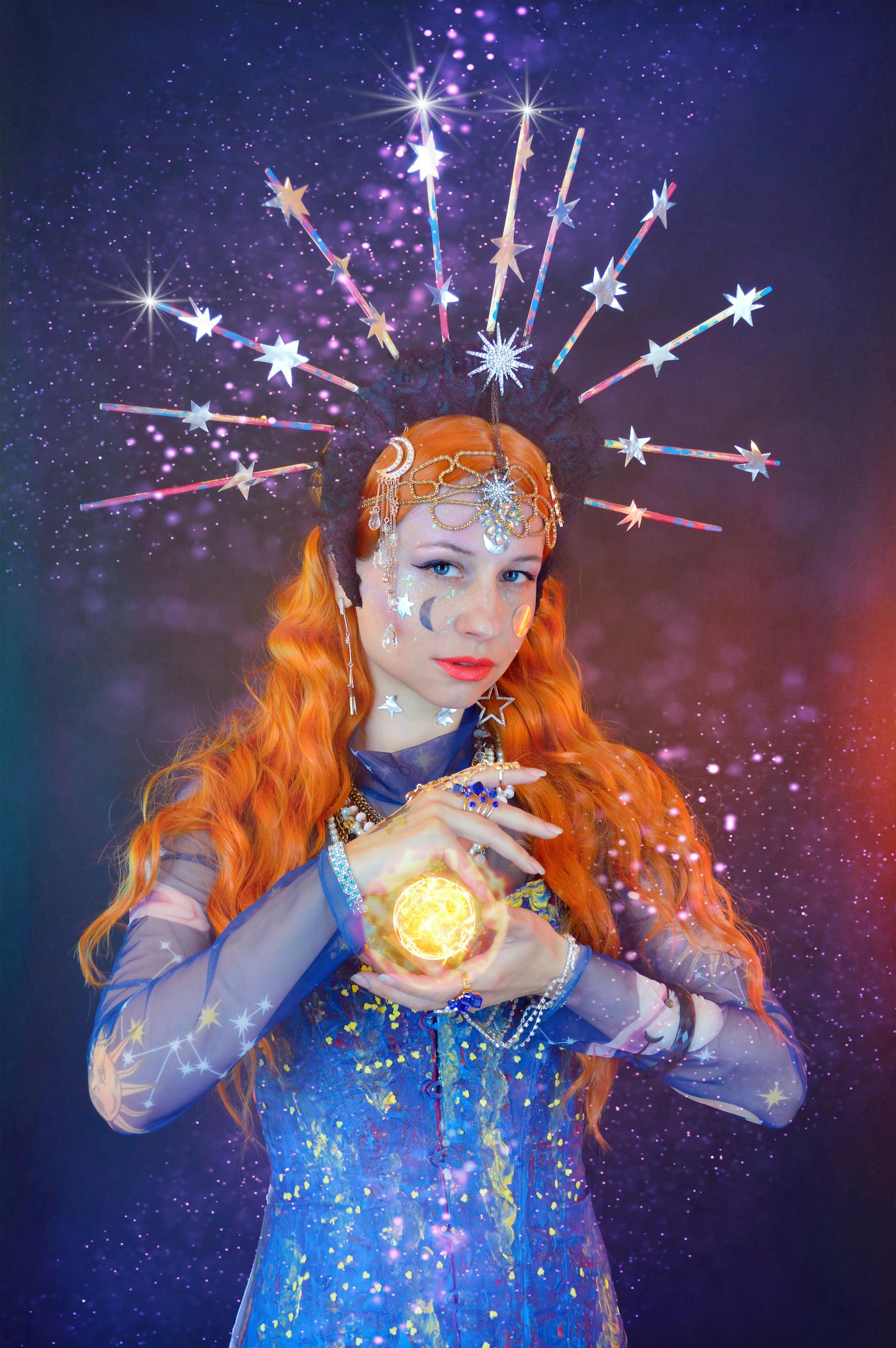 Young female astrologist predicting future with shining ball