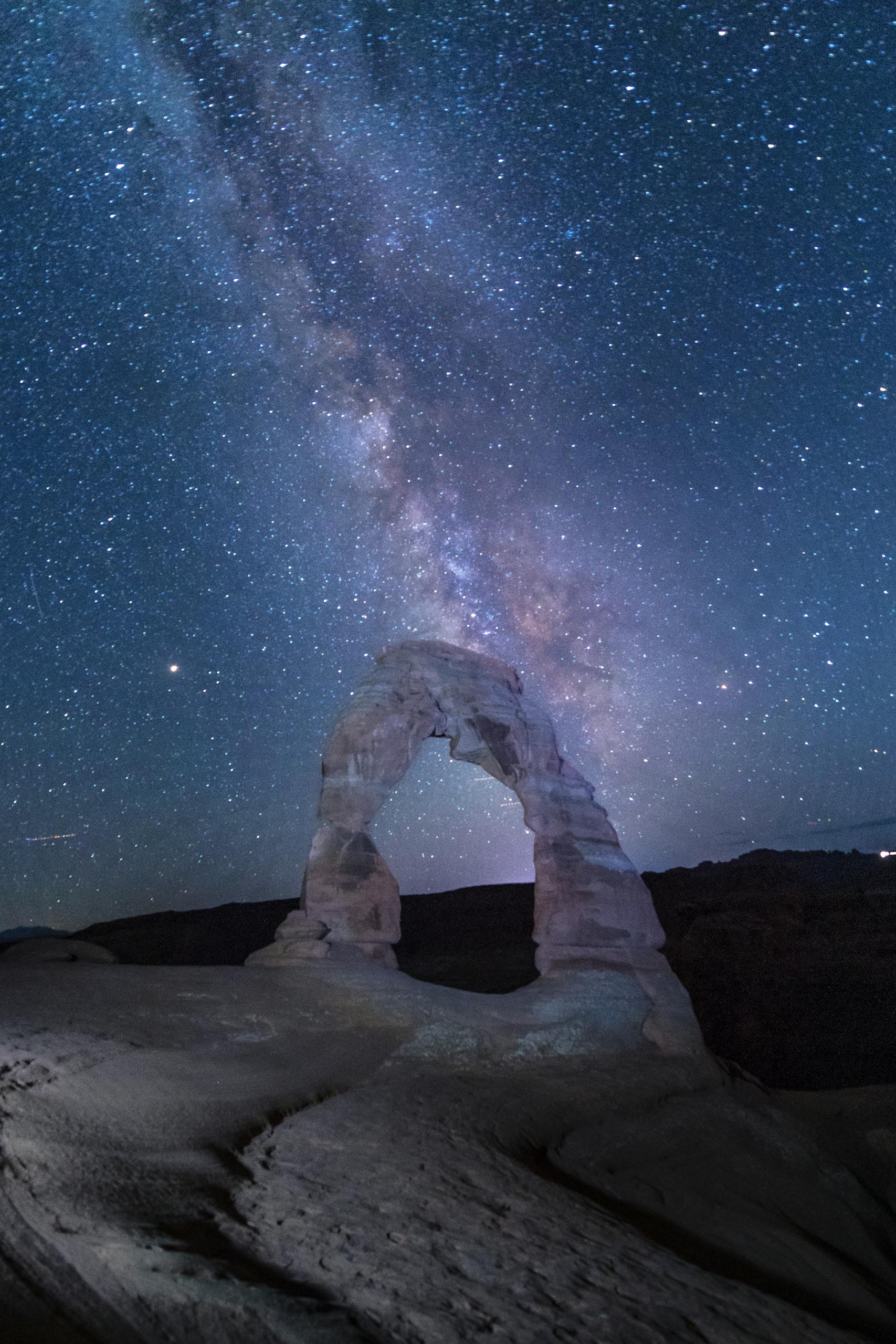 Arched Rock Formation under Starry Sky