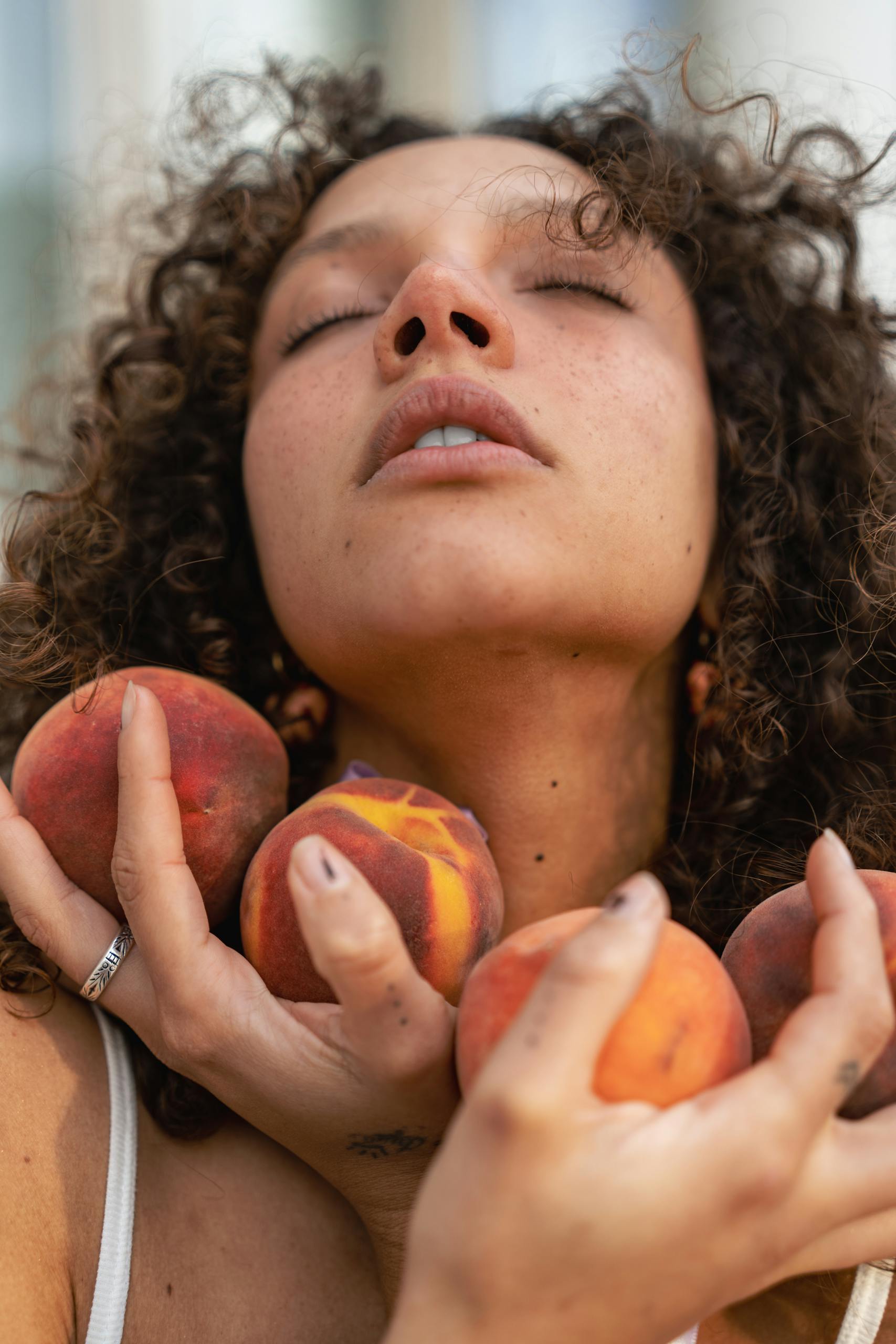 Brunette Posing with Peaches